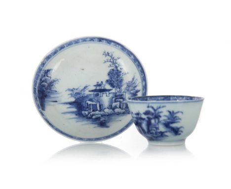 18TH CENTURY CHINESE BLUE AND WHITE NANKING CARGO TEA BOWL AND SAUCER, QIANLONG PERIOD (1736 - 1795) decorated with a pagoda 