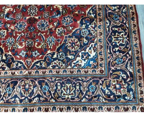 KASHAN RUG, 19TH/20TH CENTURY with red ground and blue cream central medallion, with matching spandrels265cm x 143cmColour fa