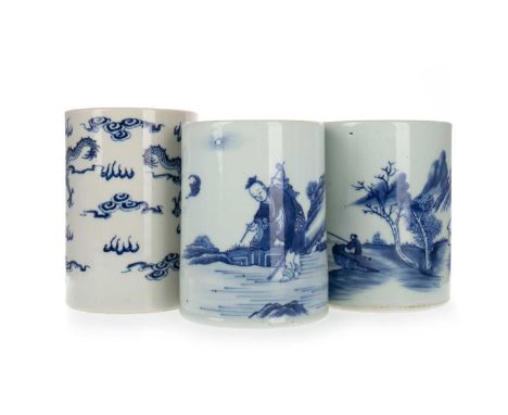 GROUP OF THREE CHINESE BLUE AND WHITE BRUSH POTS, 19TH AND 20TH CENTURY two decorated with a continuous scene, one with drago