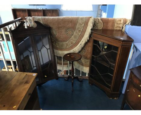 Two corner cabinets and an occasional table