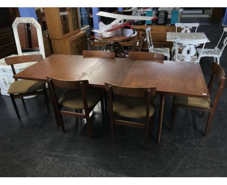 Teak dining table with six chairs, 214cm including leaf (leaf 45.5cm)