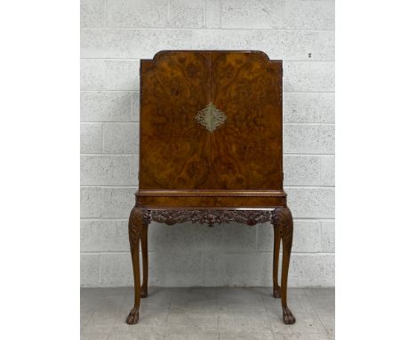 A mid century burr walnut early Georgian style drinks cabinet with fitted and mirrored interior. H.160 W.100 D.48cm 