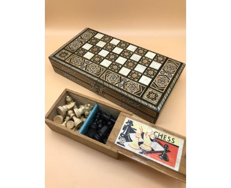 Hand turned chess pieces by K &amp; C Ltd London. Together with inlaid and mother of pearl chess board 