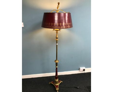 Antique floor standing heavy brass standard lamp, designed with red panels and shade. Styled with various eagle heads, claw f