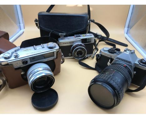 A lot of 3 vintage cameras, to include Yashica, Pentax and Olympus 