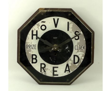 A Hovis Bread 1930's advertising wall clock, 'Prize Clock' with octagonal reverse black and white painted face, made by SEC S