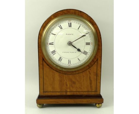 A satin walnut and mahogany strung mantel clock, the white face with Roman numerals and marked 'Plante, 3 Regent Place, W', w