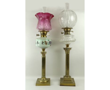A Victorian oil lamp, with Corinthian brass column on square stepped base, with clear glass reservoir and clear glass shade w
