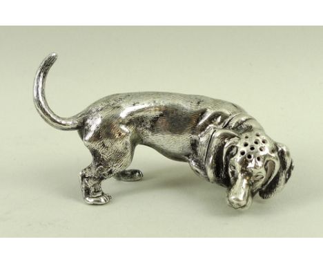 A silver pepperette in the form of a hunting dachshund, London 1819, WB for William Bateman, 2.05toz, 7 by 4cm. 