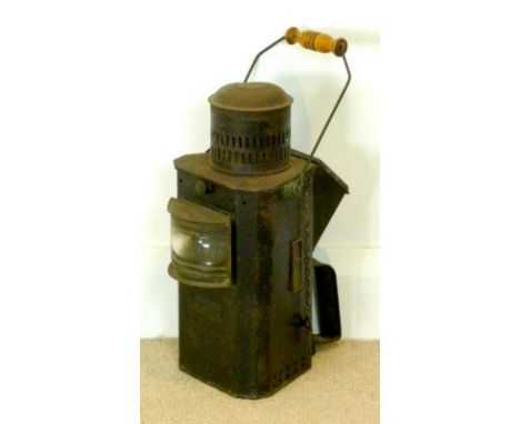 A late 19th / early 20th century tin plate paraffin Morse signal lamp, with a wide angle, narrow vertical, glass marine lens,