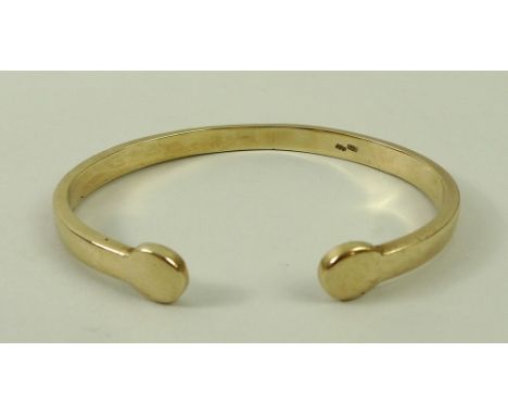 A 9ct gold torc bangle, 39g.