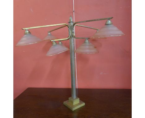 An Art Deco chrome and pink glass four branch table lamp 