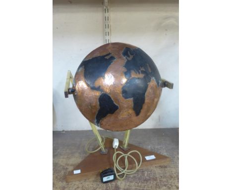 An Arts and Crafts copper and brass map of the world table lamp 