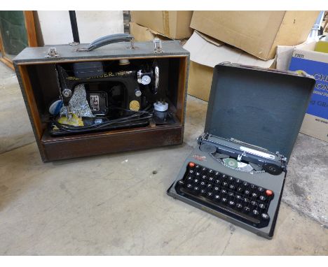 A cased Singer sewing machine and an Imperial typewriter 