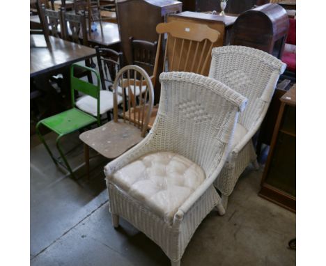 A beech rocking chair, a mid 20th Century painted metal chair, an Ercol kitchen chair, two cane armchairs and two other chair