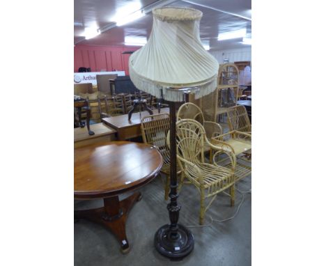A carved mahogany standard lamp 
