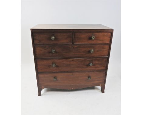 A Regency mahogany caddy top chest of drawers with boxwood strung frieze above two short and three long graduated cock beaded