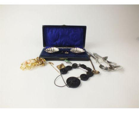 A pair of cased silver shell salts, together with a collection of silver plated and white metal spoons, coins, a coral and se