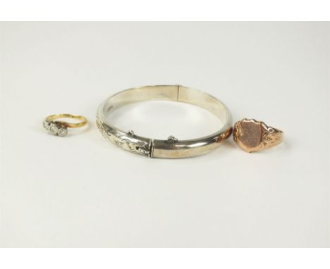 A 9ct gold signet ring, weight approx 3g, together with a three stone graduated diamond ring, a hinged silver bangle, a simul