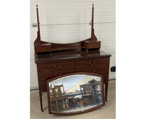 An Edwardian satin wood dressing table with inlaid detail, tapered legs and brass caster feet. Curve sided mirror (not fixed 