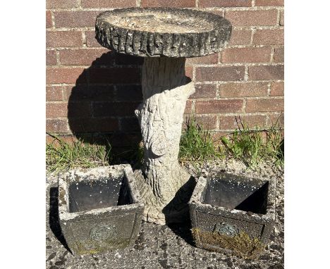 A large weathered garden bird bath in the form of a tree trunk together with a small pair of square shaped planters with tudo
