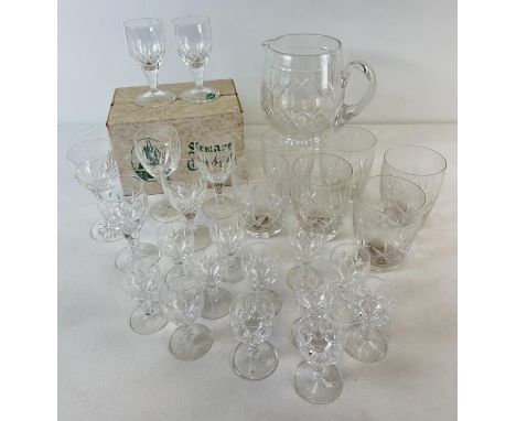 A collection of Stuart Crystal glasses and a jug. To include a set of 6 boxed (as new) stemmed sherry glasses, a set of 12 sm