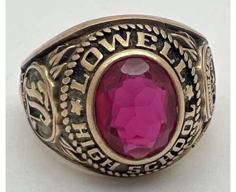 A vintage 1970 10ct gold American Lowell High School signet ring set with an oval red stone - tests as ruby. Year date and in