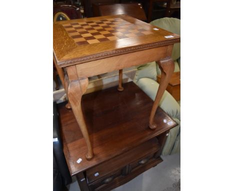 A vintage mixed wood occasional table having chequer board top