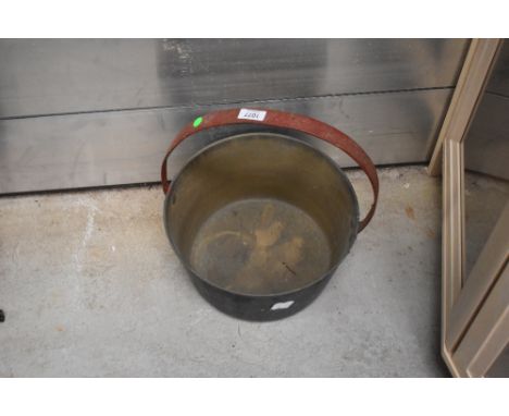 A vintage brass cast jam pan