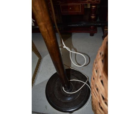 A traditional oak standard lamp