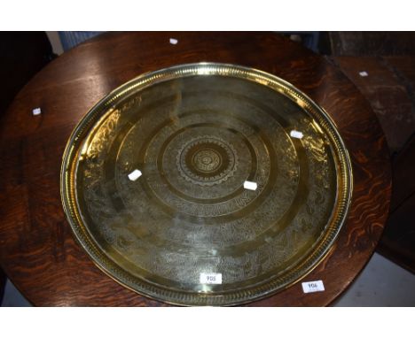 A vintage brass tray, having hieroglyphic and other decoration, width approx. 58cm
