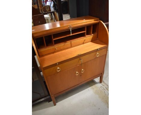 A vintage teak or sapele roll top desk, width approx. 85cm