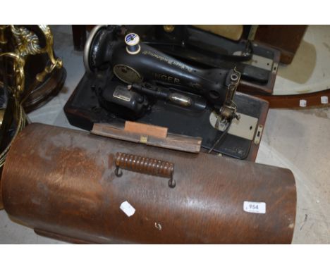 A vintage singer sewing machine (electric) in oak case , wiring removed for safety