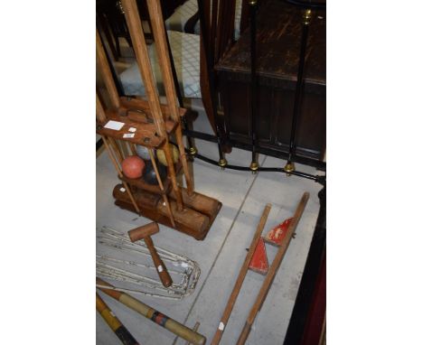 A vintage croquet set including oak mallet stand