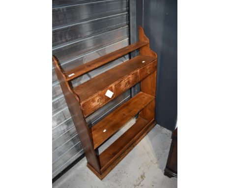 A traditional pine wall shelf