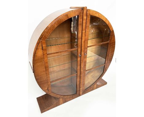 ART DECO DISPLAY CASE, figured walnut of circular form with two half round glazed doors enclosing shelves, 122cm x 129cm H x 