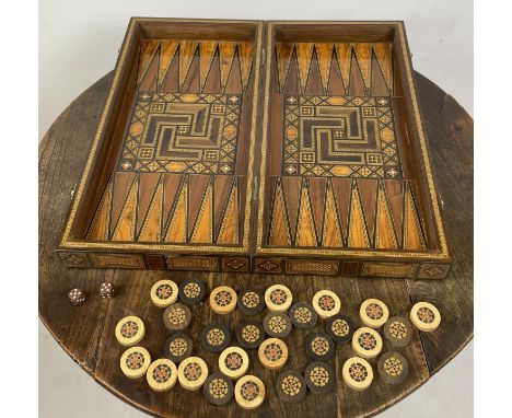 FOLDING CHESSBOARD AND BACKGAMMON BOX, Islamic burr walnut boxwood and kingwood marquetry with mother of pearl and game piece