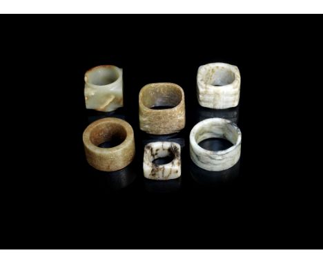 A group of six jade cong&nbsp;Variously of plain form, carved with trigrams, archaic style script and geometric designsThe la