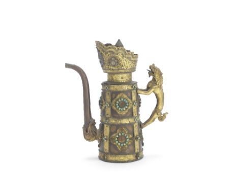 A parcel gilt copper-alloy ewer, duomuhuTibet, 19th centuryThe cylindrical body decorated with gilt foliate strapwork bands a