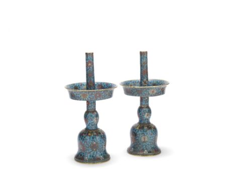 A large pair of cloisonné enamel turquoise-ground candlesticks18th/19th centuryInlaid on the dark turquoise ground with elabo
