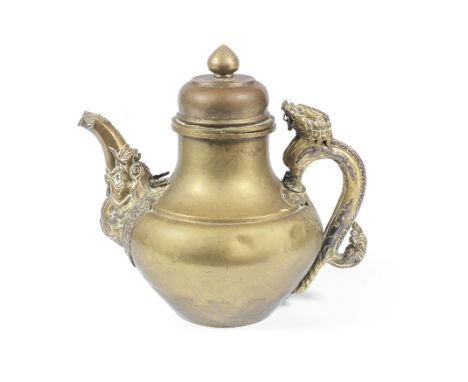A copper and silver inlaid brass-alloy ewerTibet, 18th/19th centuryThe pear-shaped body with Makara spout and dragon handle, 