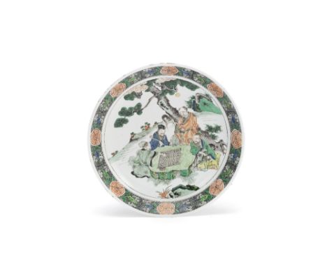 A famille verte figural dishKangxiDecorated with a group of gentlemen gathered at leisure in a landscape of pine and rockwork