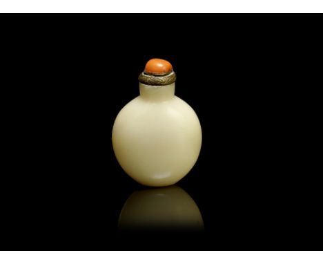 A white jade snuff bottle18th/19th centuryOf flattened rounded form, the stone of milky-white tone with a faint russet inclus