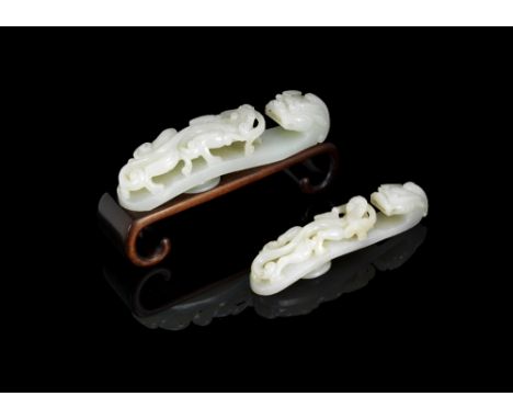 Two pale green jade 'chilong' belthoooks18th/19th centuryEach similarly carved in openwork relief with a forward striding chi