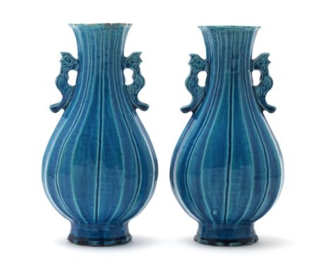 A pair of turquoise glazed vasesKangxiEach of flattened baluster form with ribbed bodies and flaring necks rising to everted 