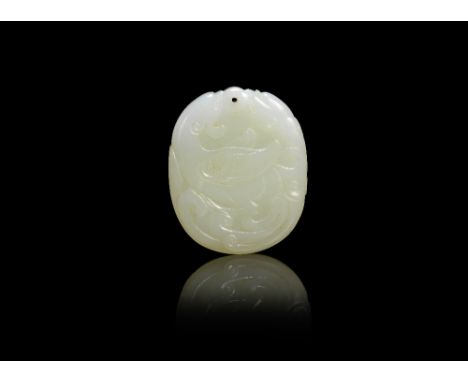 A pale green jade pendantQing DynastyOf oval form, carved in low relief with confronting sinuous chilong. 5.3cm (2.1/8in) lon