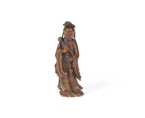 A fine bamboo carving of Guanyin18th centuryThe figure elegantly modelled, wearing long flowing robes with elaborate drapery,