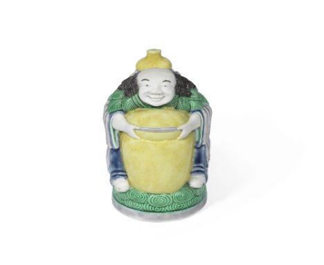 A famille verte biscuit figural waterdropper and stopper19th centuryModelled as a mythical character, seated on a circular cl