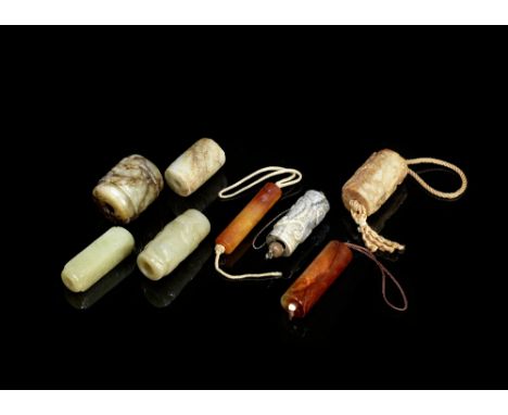 A group of eight jade and hardstone beadsSong Dynasty and laterOf cylindrical form, variously carved with chilong, mythical b