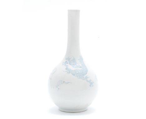 A Blue and White Bottle vaseXuande four-character mark, 18th centuryDelicately painted with a writhing dragon encircling the 
